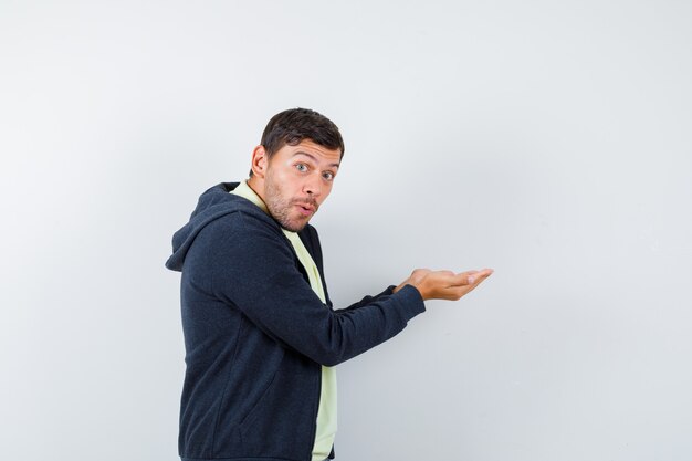 Expressive young man posing in the studio