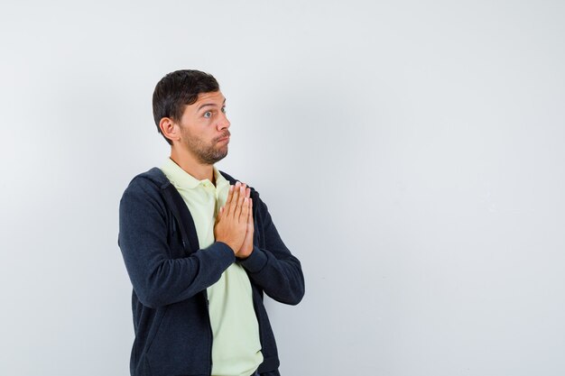 Expressive young man posing in the studio