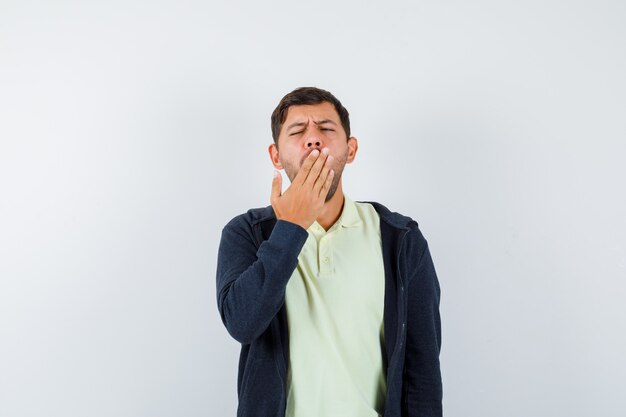 Expressive young man posing in the studio