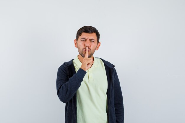 Expressive young man posing in the studio