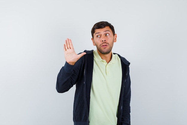 Expressive young man posing in the studio