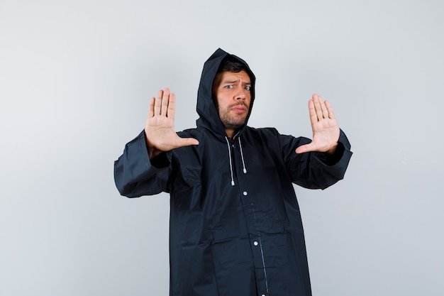 Expressive young man posing in the studio