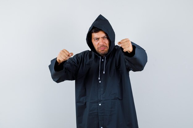 Expressive young man posing in the studio