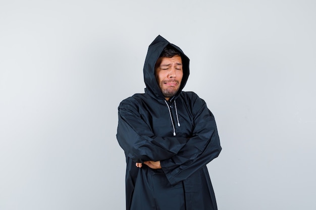 Expressive young man posing in the studio