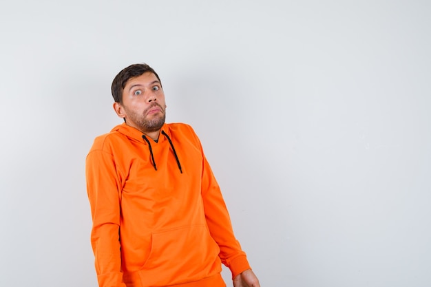 Expressive young man posing in the studio