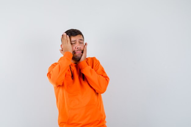 Expressive young man posing in the studio