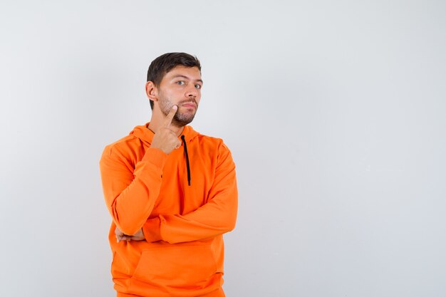 Free photo expressive young man posing in the studio