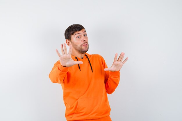 Expressive young man posing in the studio