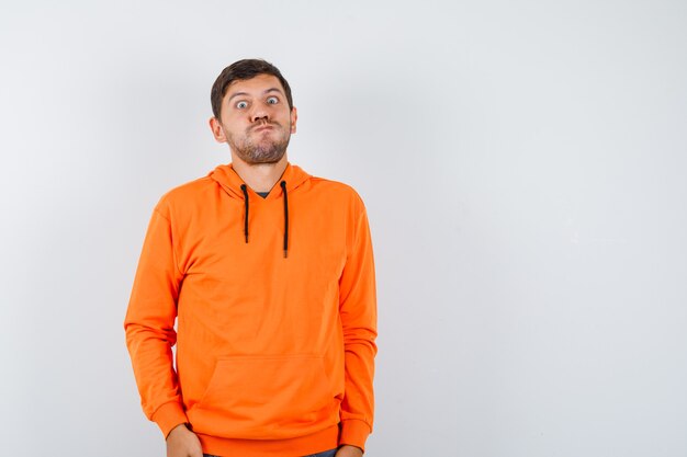 Expressive young man posing in the studio