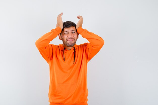 Expressive young man posing in the studio