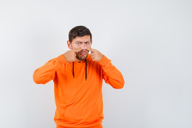 Expressive young man posing in the studio