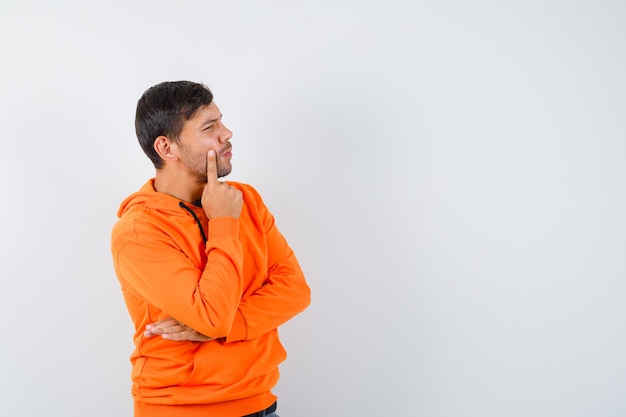 Free photo expressive young man posing in the studio