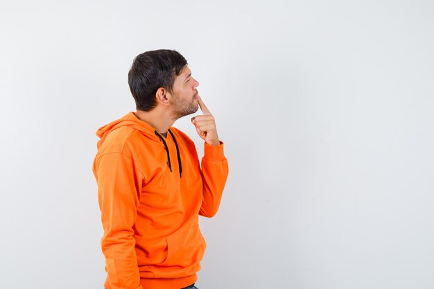 Expressive young man posing in the studio