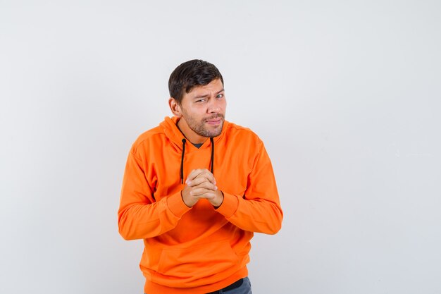 Expressive young man posing in the studio