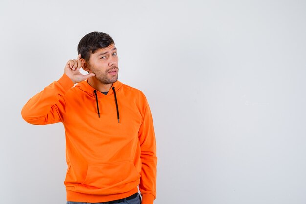 Expressive young man posing in the studio