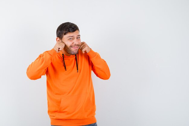 Expressive young man posing in the studio