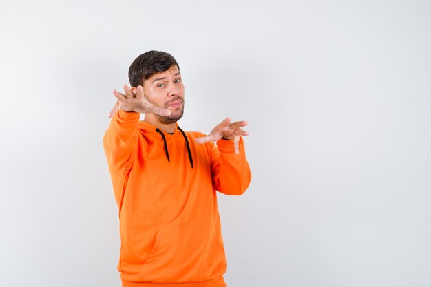 Expressive young man posing in the studio