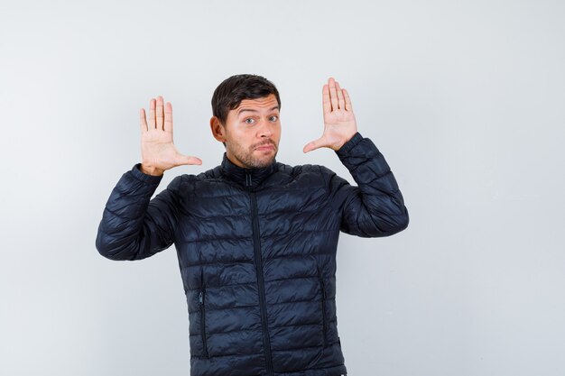 Expressive young man posing in the studio