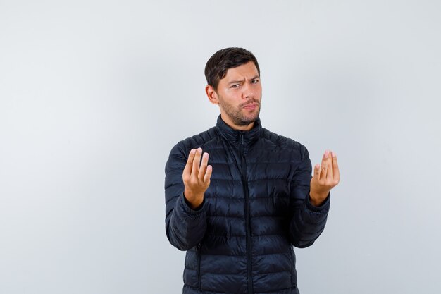 Expressive young man posing in the studio