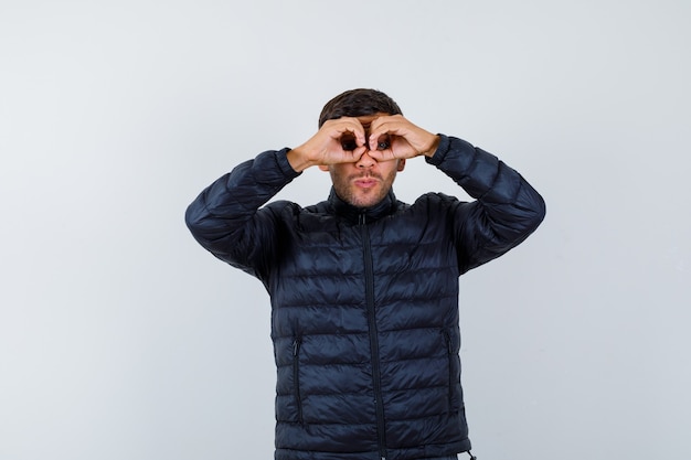 Expressive young man posing in the studio