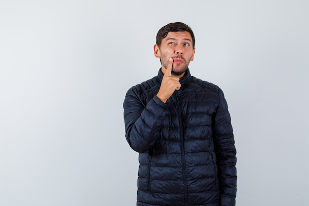 Expressive young man posing in the studio