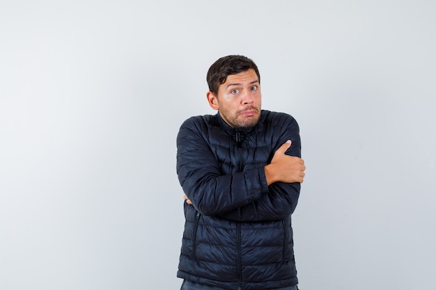 Expressive young man posing in the studio