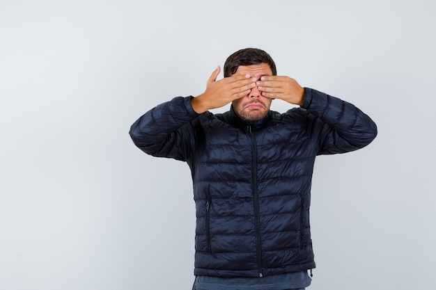 Expressive young man posing in the studio