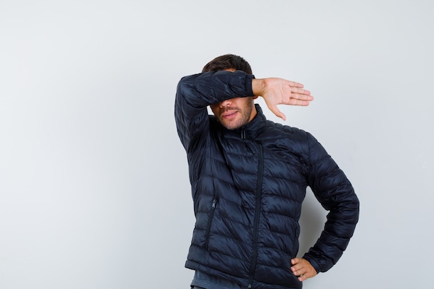 Expressive young man posing in the studio