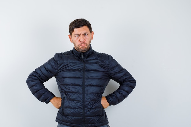 Free photo expressive young man posing in the studio