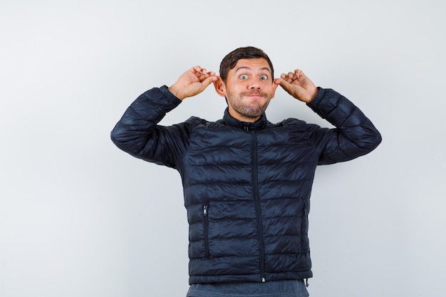 Expressive young man posing in the studio