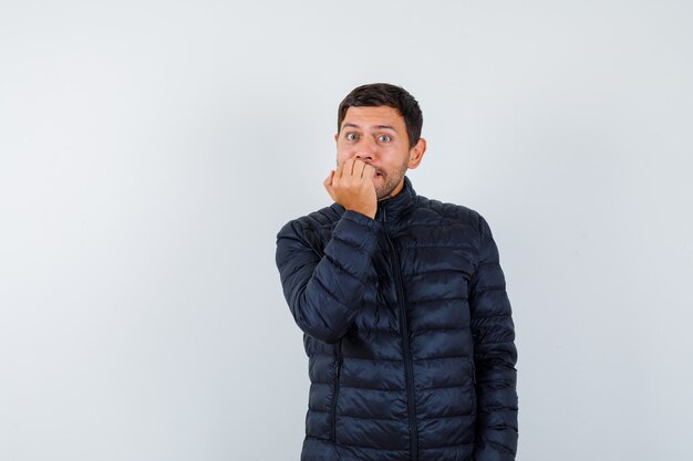 Expressive young man posing in the studio