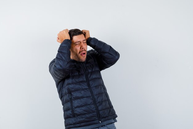 Expressive young man posing in the studio