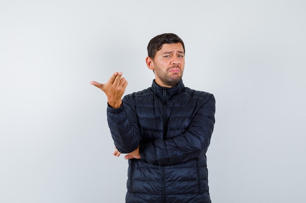 Expressive young man posing in the studio