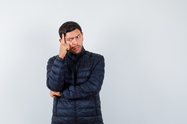 Expressive young man posing in the studio