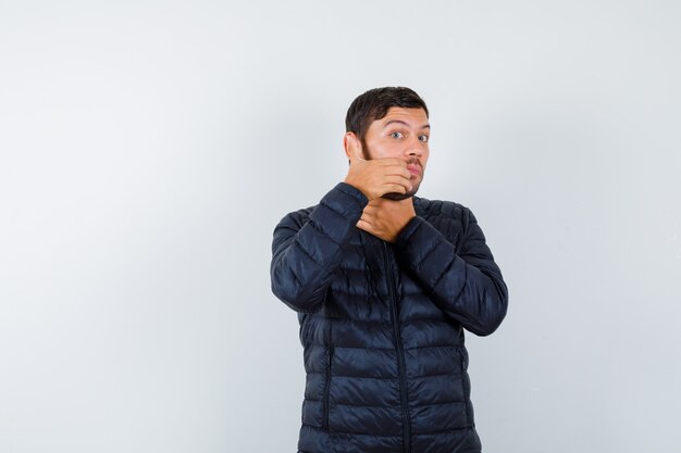 Expressive young man posing in the studio