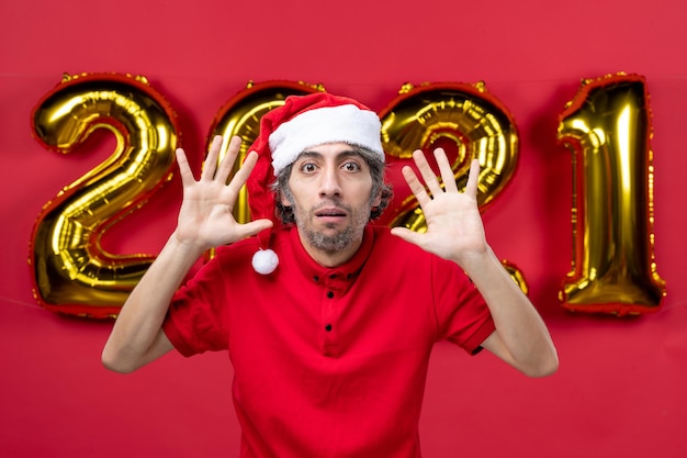 Expressive young man posing for winter holidays