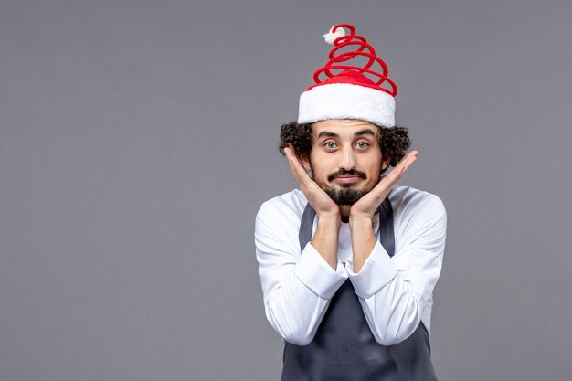 Expressive young man posing for winter holidays