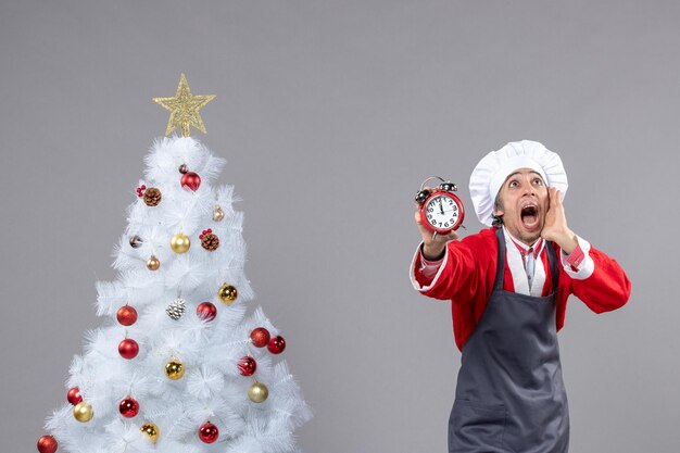 Expressive young man posing for winter holidays