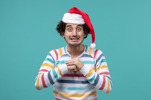 Expressive young man posing for winter holidays