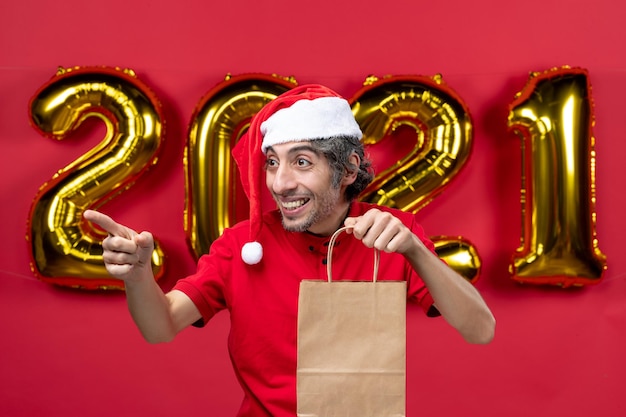 Free photo expressive young man posing for winter holidays