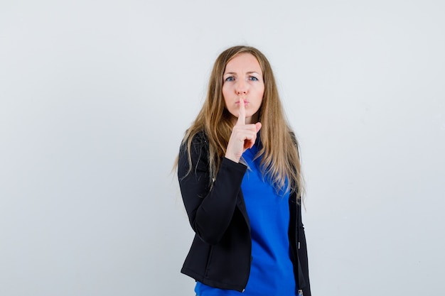 Expressive young woman posing in the studio