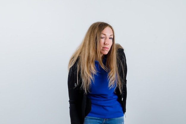 Expressive young woman posing in the studio