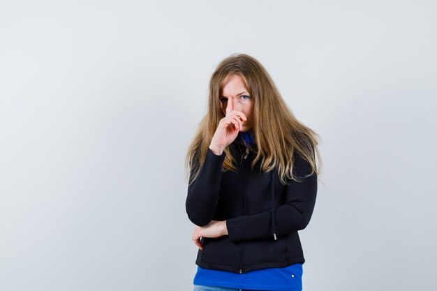 Expressive young woman posing in the studio