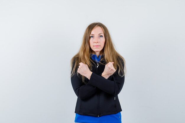 Expressive young woman posing in the studio