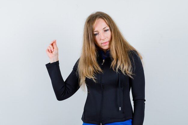 Expressive young woman posing in the studio