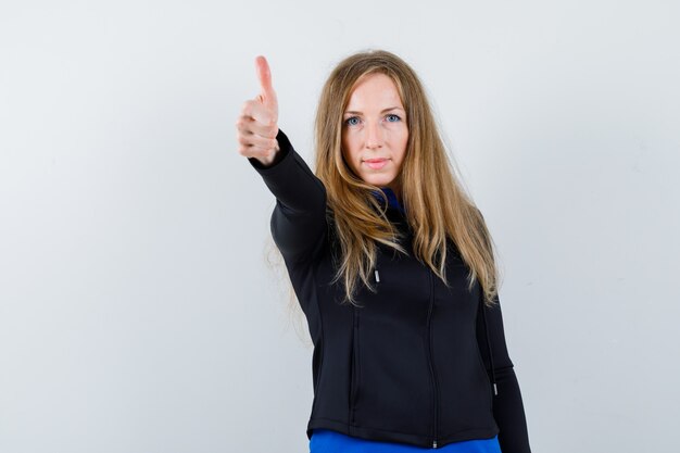 Expressive young woman posing in the studio