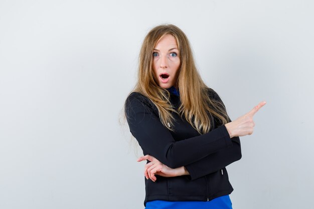 Expressive young woman posing in the studio