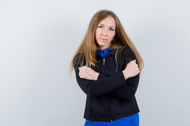 Expressive young woman posing in the studio