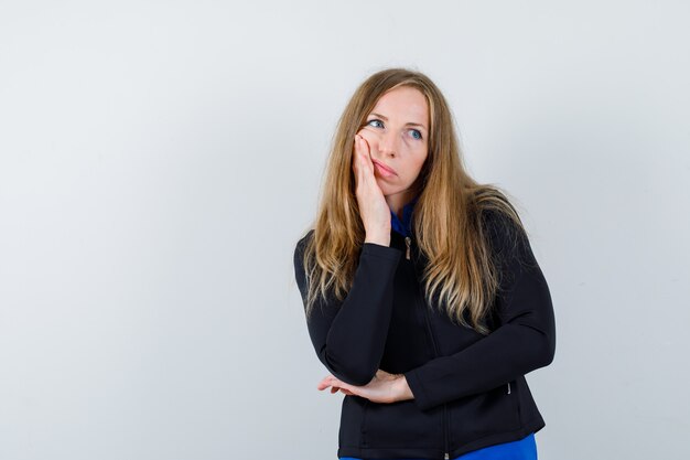 Expressive young woman posing in the studio