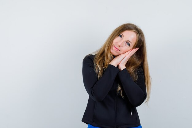 Expressive young woman posing in the studio